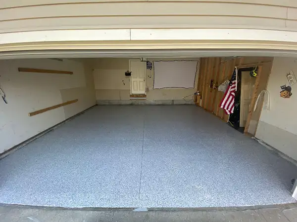 Garage floor after polyurea flake coating — Walchak Concrete project 4
