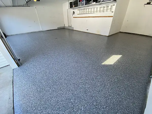Garage floor after polyurea flake coating — Walchak Concrete project 5