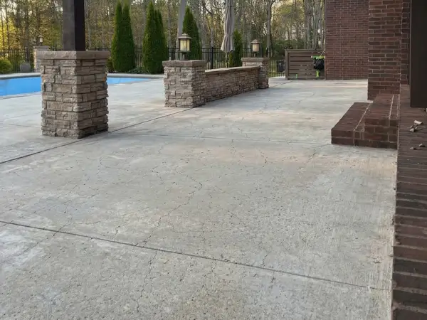 Discolored porch concrete with sun and weather damage